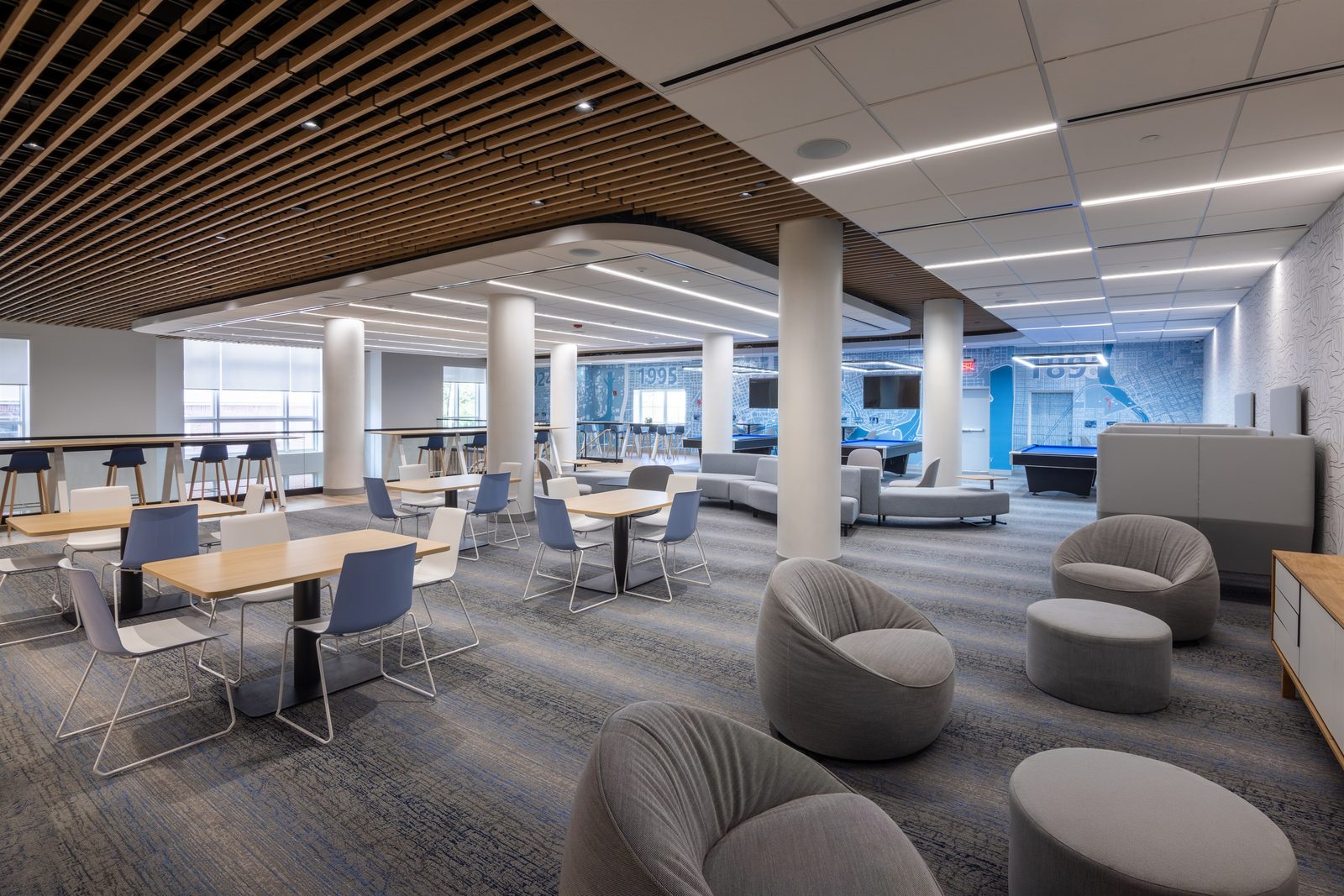 Completed university recreation and wellness center lounge with curved seating and open dining area, built by Reno Boyd Building Co.